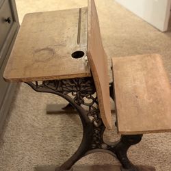 Antique child’s wooden and cast-iron folding row desk