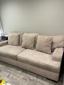 Beige textured fabric sofa with loveseat from Ashley furniture