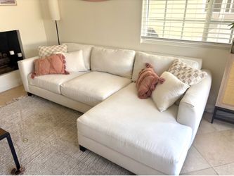 Living Spaces Quinton II - White Sectional Sofa with Right-Hand Chaise.