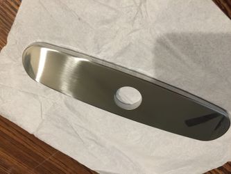 Brand new stainless single control kitchen faucet escutcheon.