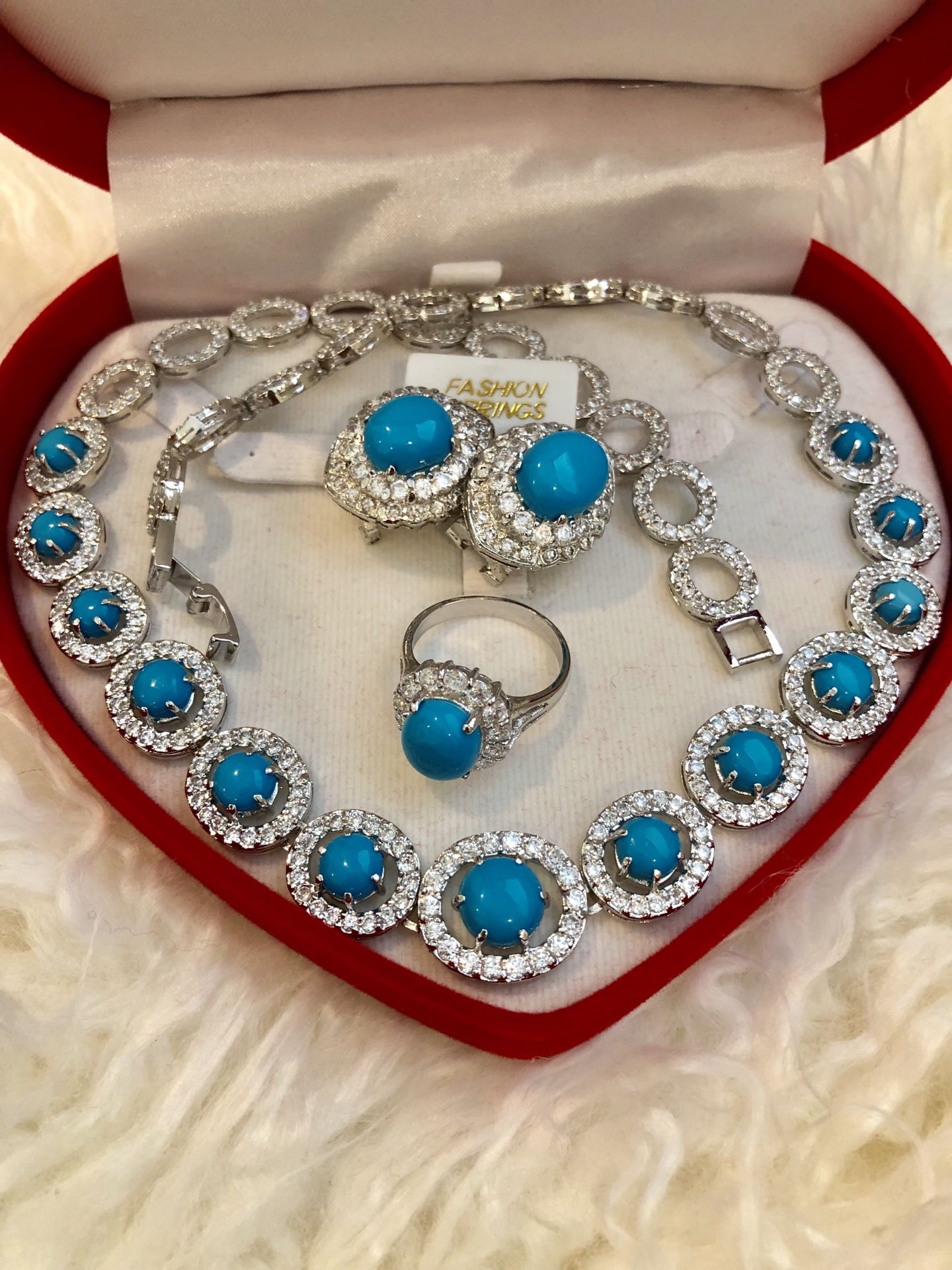 Brand new - comes in a red velvet box. Semi-precious turquoise set