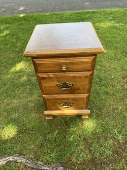 Brown Wood Nightstand With Three Drawers