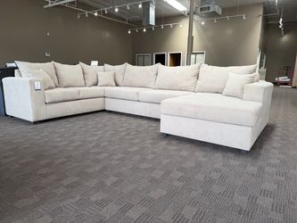 Large beige comfy sectional sofa