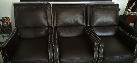 3 brown reclining chairs