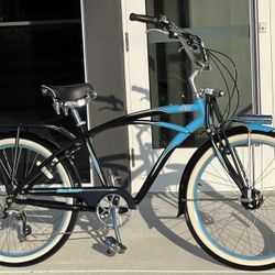 Felt Heritage Skip Tooth 26″ aluminum frame 7 speed torpedo light cruiser bike with rim brakes.