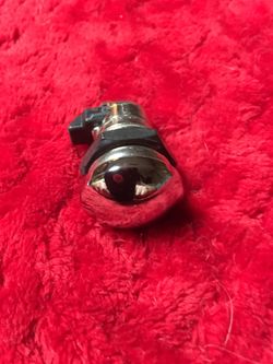 SMOOTH PUSH-BUTTON FUEL CONSOLE DOOR RELEASE