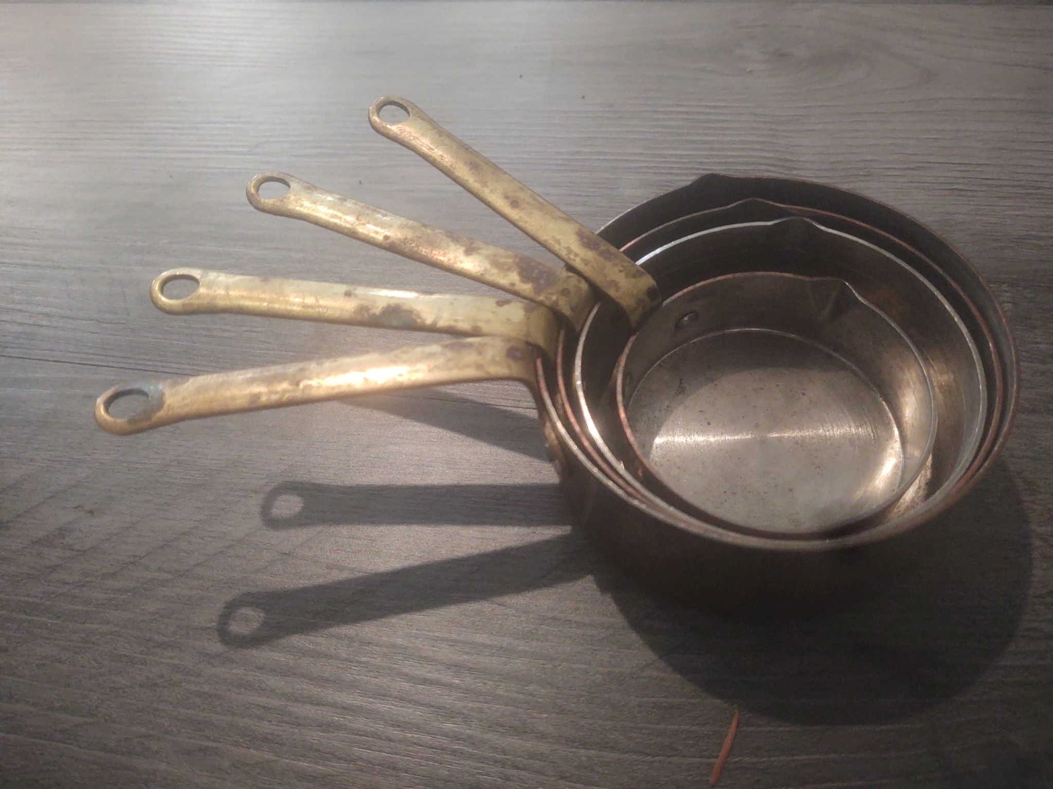 Vintage copper and brass measuring cups