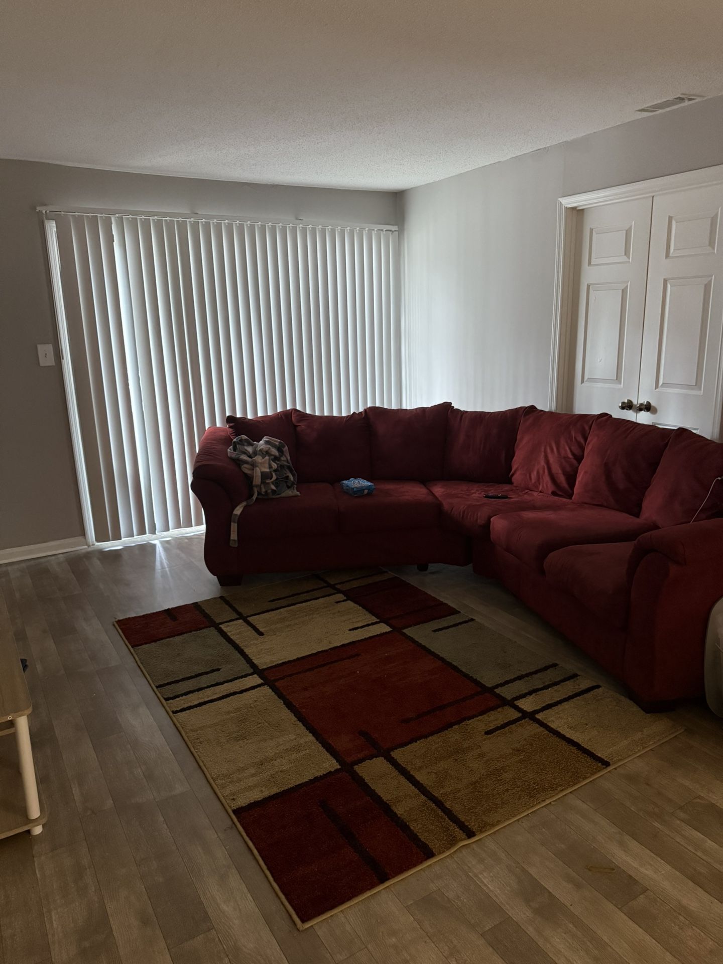 Red more of a brick red sectional & Rug