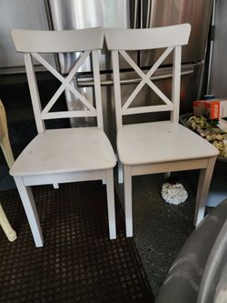 Two wood  white chairs 