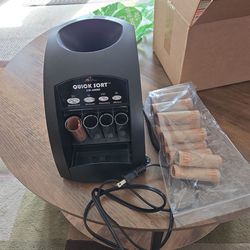 Electric coin counter with box of wra