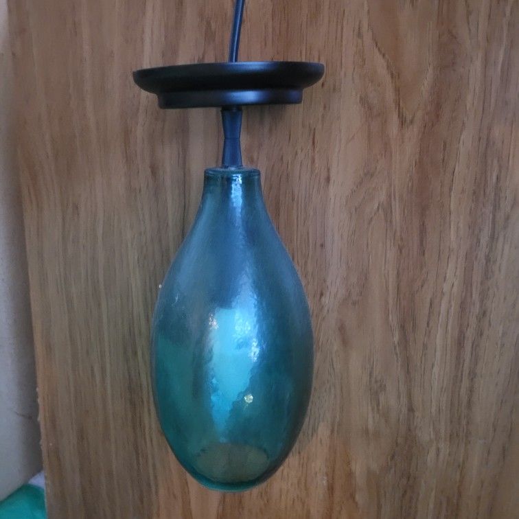 2 green glass ceiling hanging lights.