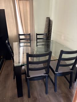 Glass top dinning table 54” x 54”  half inch glass tinted  w/ 5 matching chairs
