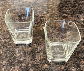 Crown Royal branded square rocks glasses featuring an embossed logo on the bottom.
