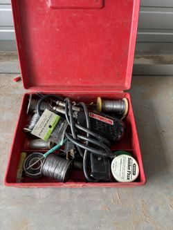 soldering Iron And Rolls Of Solder