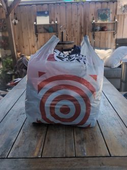 Small bag filled with athletic clothes + a cap