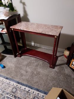 MARBLE  CONDOLE TABLE 36 INCHES WIDE AND 30 INCHES HEIGHT AND. 15 DEPTH.$40.00