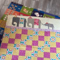 Quilt 42x53 hand sewn  multitude of colors and patterns  elephant trio at top 
