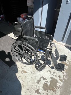 Wheelchair with tilt leg rests