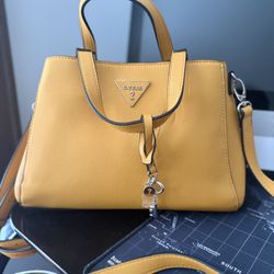 Mustard Yellow Elegance , Add a pop of color to your outfit with this stylish Guess handbag. Perfect for brunch dates, office slay, or casual outings.