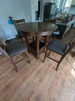 **price negotiable** Tall dining room table & chairs