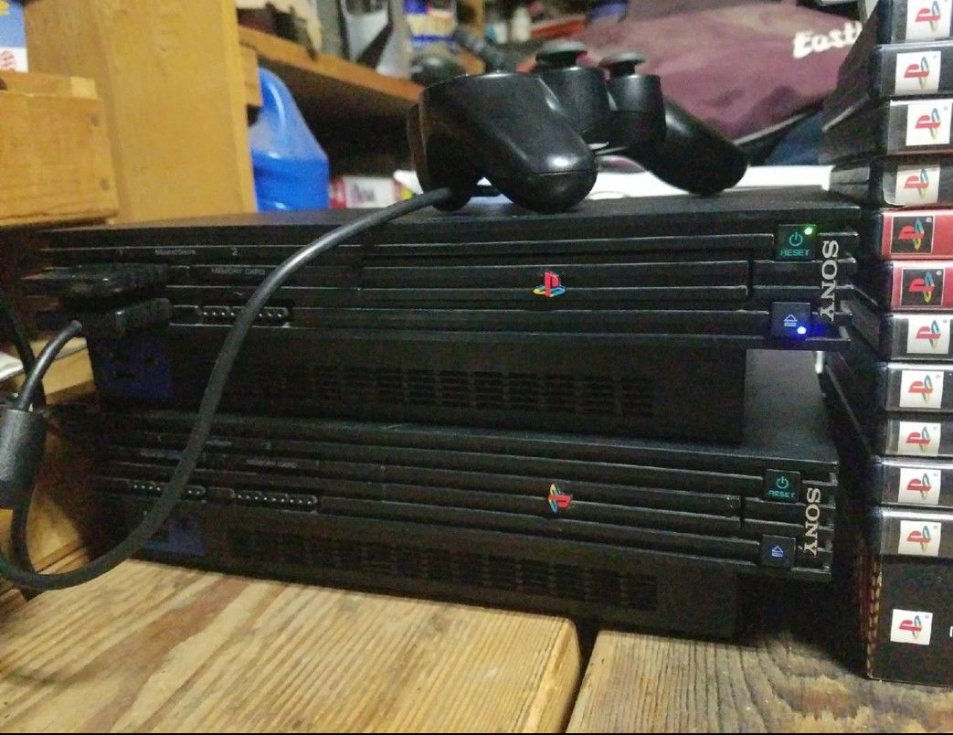 2 consoles and 1 controller ps2 playstation 2