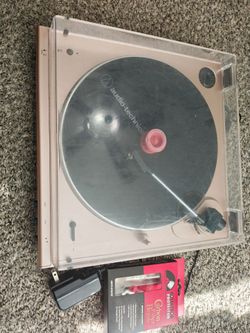 Audio-Technica AT-LP60XBT wireless belt-drive turntable in a rose gold finish.