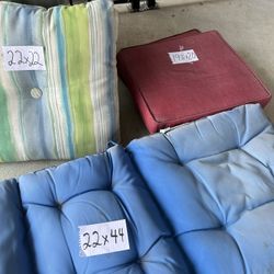 All Outdoor Cushions Except Two Red Cushions