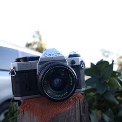 Canon AE-1 Program + 28mm Quantaray Prime 35mm Film Camera