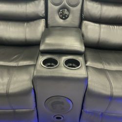 New leather reclining sectional with speakers