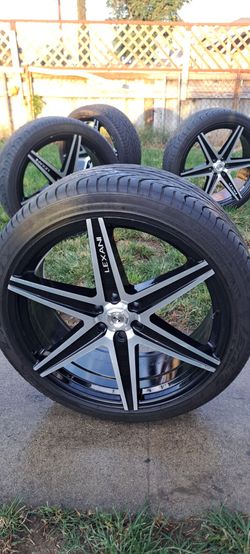 24 inch Lexani rims and tires..