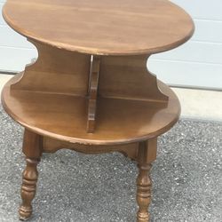 Maple 2 Tier Lamp Table / End Table.  Used in good condition with some cosmetic blemishes. These blemishes are in the form of scratches and scuff mark
