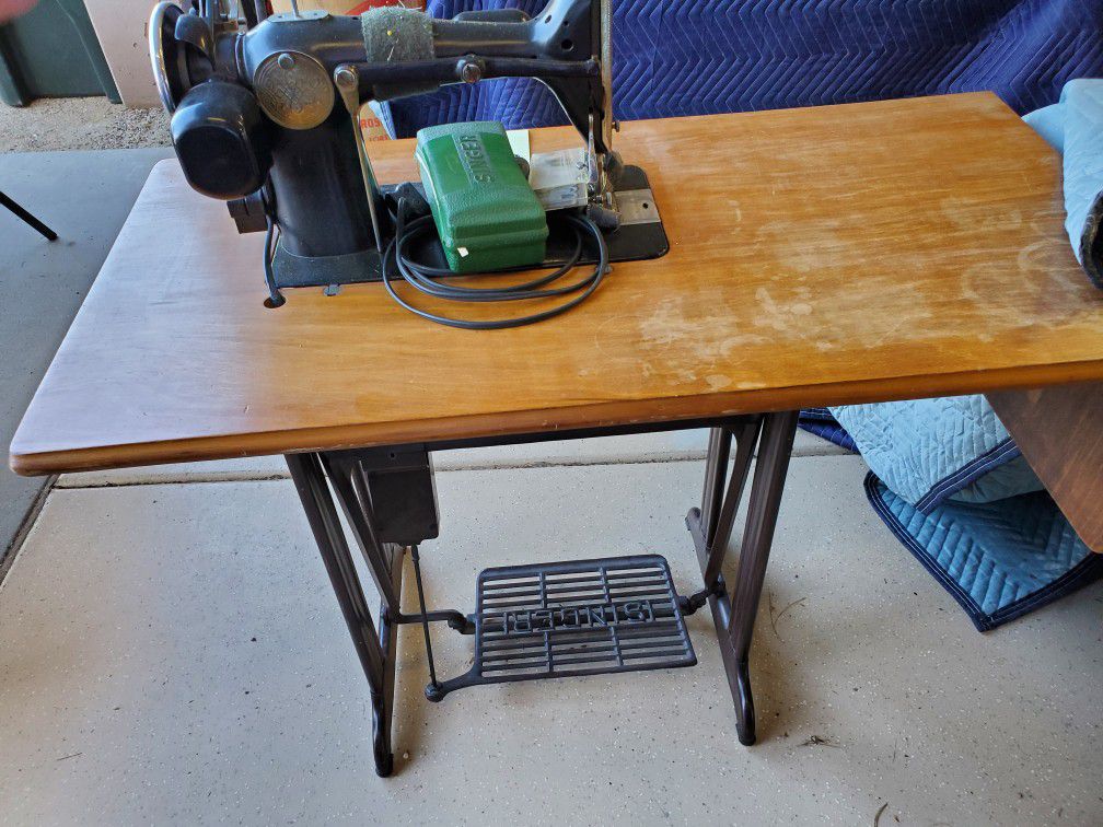 Antique Sewing Machines And Desk