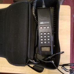 One of the original Motorola car cell phones has battery pas battery pack complete