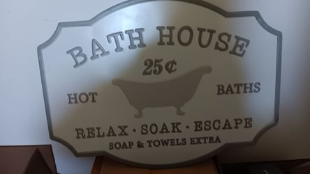 Large metal bath house sign