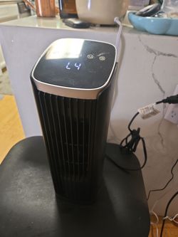 Brand new! Electric. Rotating tower fan.