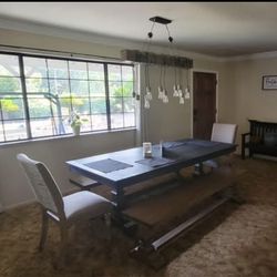 Farmhouse Dining Table with Benches and two chairs.
