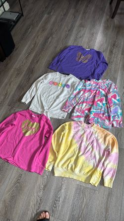Girls sweaters size 10,12 in new condition some new