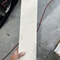 4 by 16 Crema Marfil Select polished marble tile.