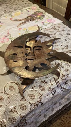 Vintage metal 3d sun & moon wall plaque.    19 1/2 inch circular