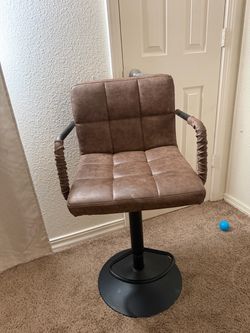 Brown leather bar stool with black metal base and armrests #barstool #leather