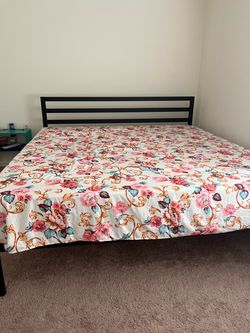 Black metal king bed frame