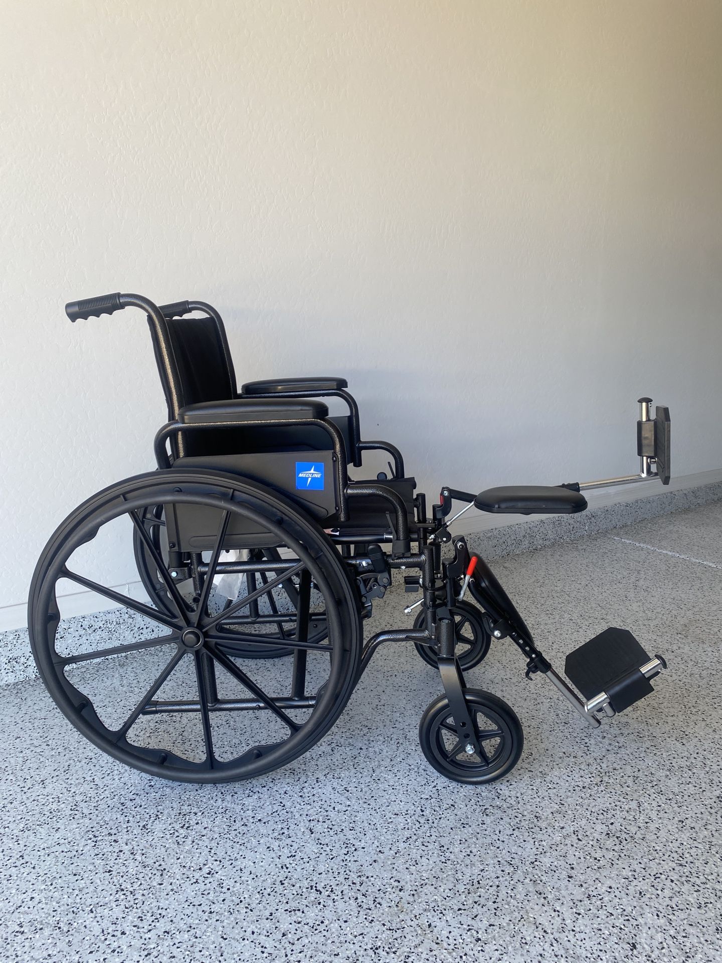 Wheelchair With Elevating Foot Rests