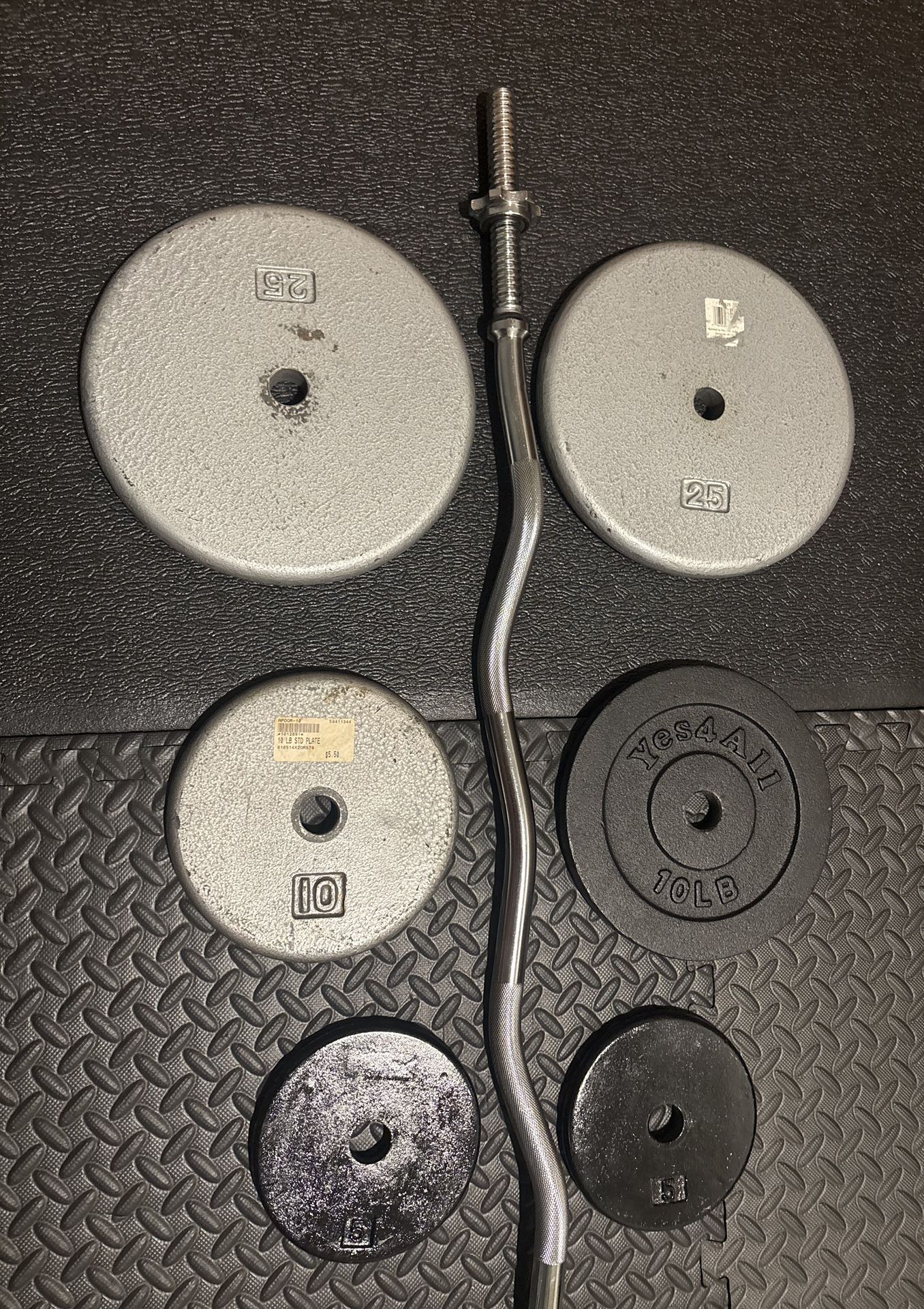 NEW Standard Steel Curl Bar with Cast Iron Weight Plates Gently Used pairs: 24#, 10 & 5 #. Total: 96 pounds