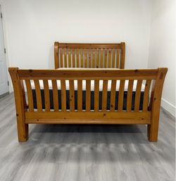 Nice Wooden Queen size bed. Mattress and boxspring included for free. Delivery available for an additional cost.