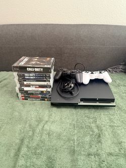 A PlayStation3 with two controllers and 11 games