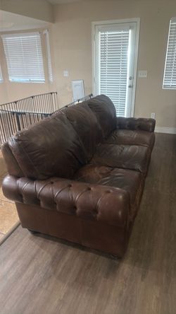 Italian leather couch and a chair with an armor.