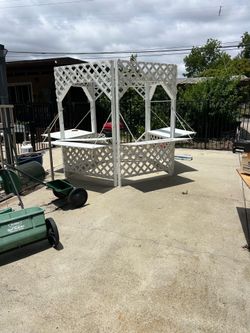 Outdoor Garden/display booth gazebo with folding down shelves.
