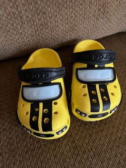 Crocs. Race cars  size :   C8.  20 bucks