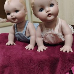 Pair Of Porcelain Dolls 