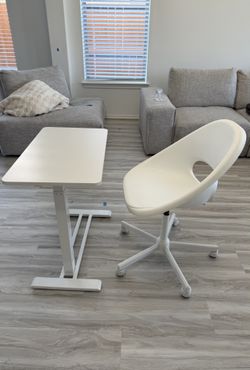 Height adjustable sit stand desk on wheels and IKEA loberget swivel chair